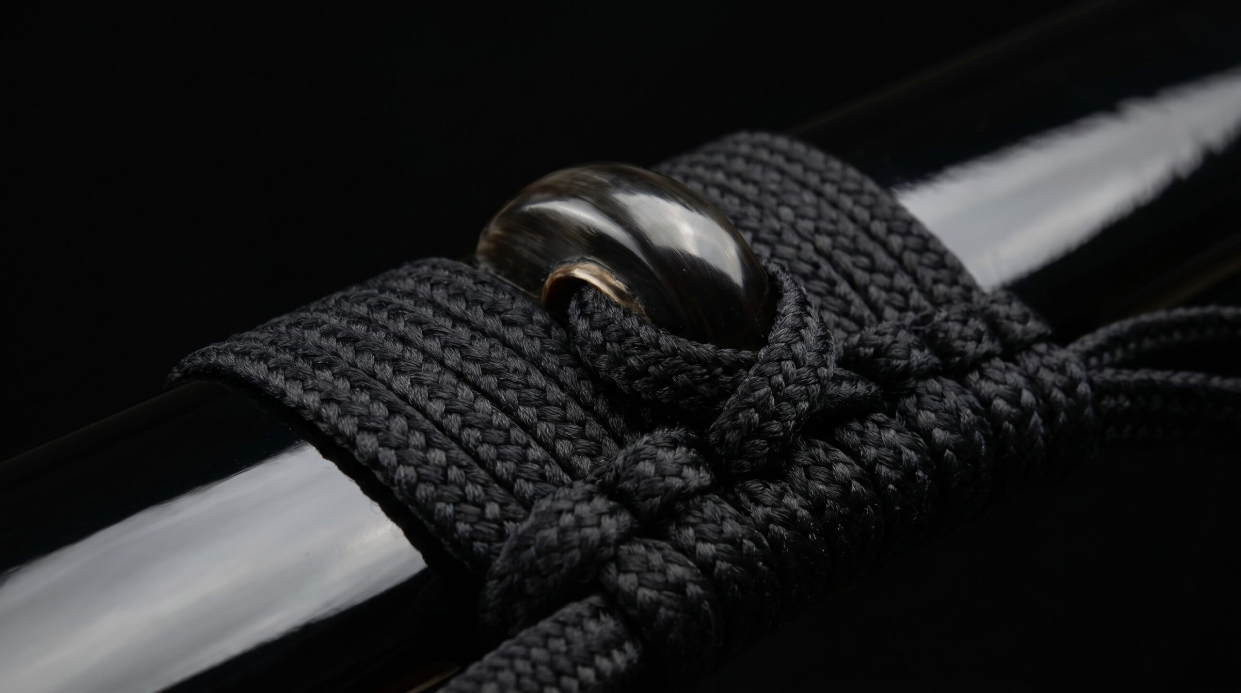 Kurikata knob with sageo cord wrapped through it